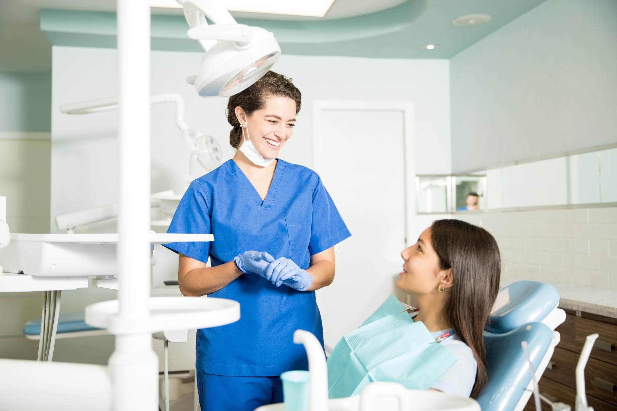 Holistic dentist talking with a patient in Louisville, KY